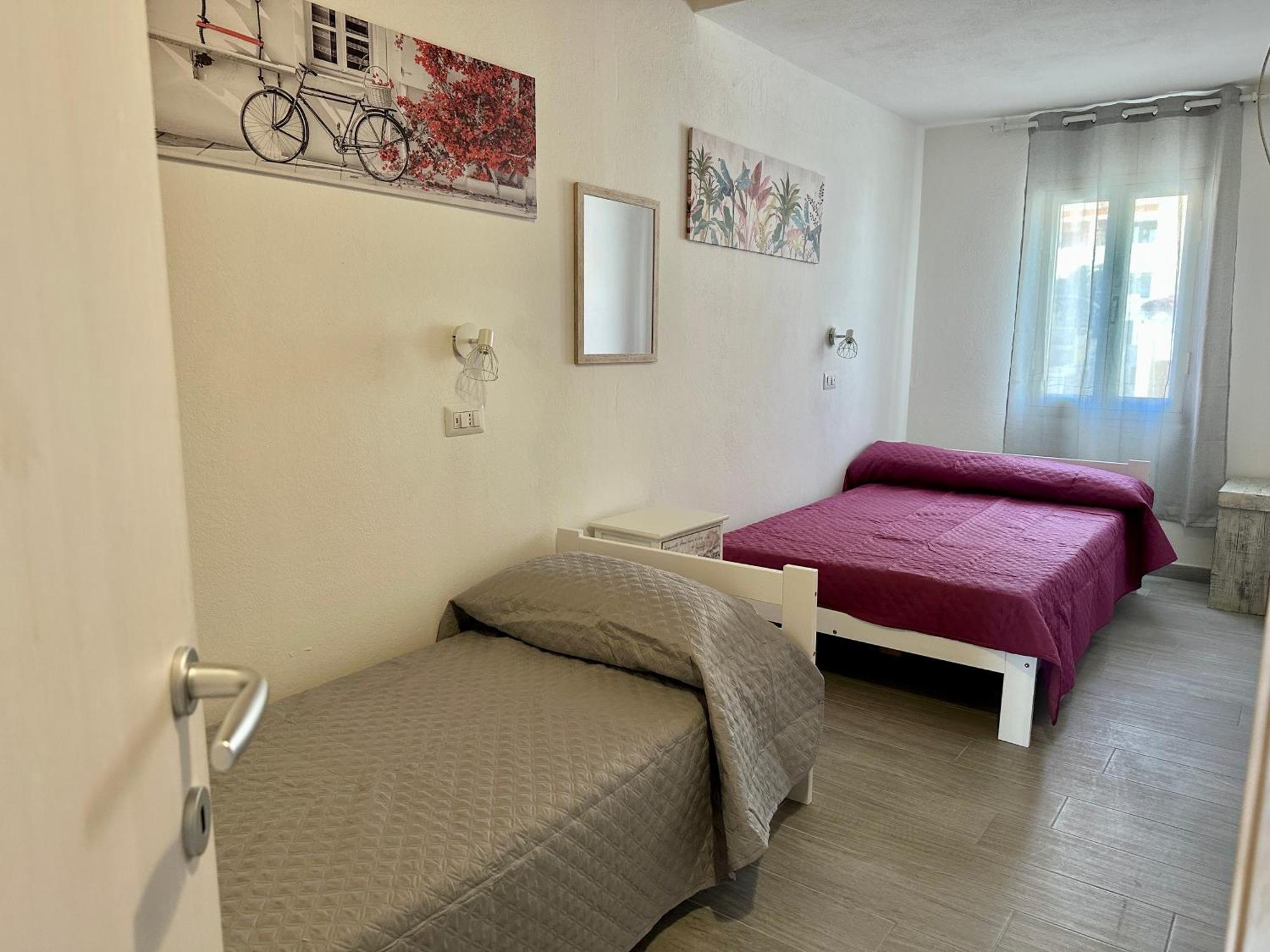 Approdo Apartments Isola Rossa Bagian luar foto